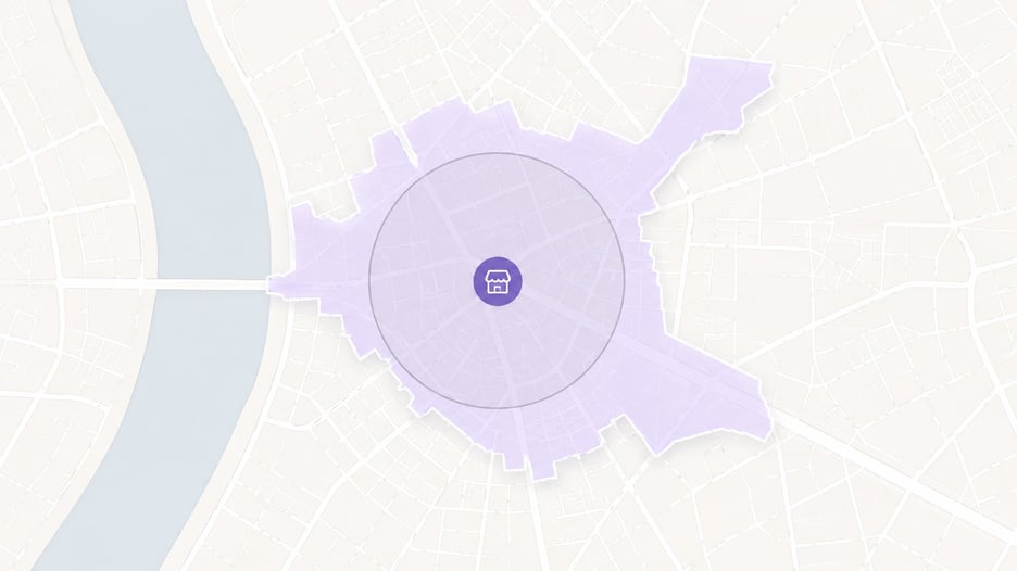 Ilustração de mapa comparando um raio circular perfeito com uma isócrona irregular que segue as ruas e atravessa o rio apenas na ponte, ao redor de uma loja marcada no centro